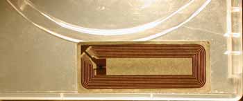 MeadWestvaco RFID tag with top layer of paper removed on standard DVD case